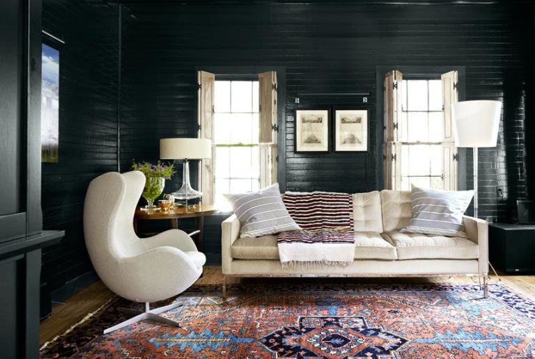 Black shiplap is the new white! An edgier take on the farmhouse trend, black shiplap is a great way to combine modern and farmhouse style. Let's admire these interiors that embrace the moodier side of shiplap! Welcome to the dark side. #blackshiplap #modernfarmhouse #shiplap