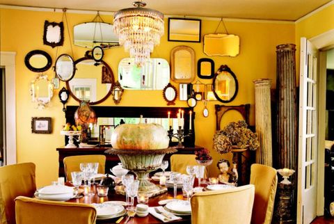 yellow dining room with mirrors