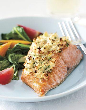 cooked salmon on a plate with fresh vegetables