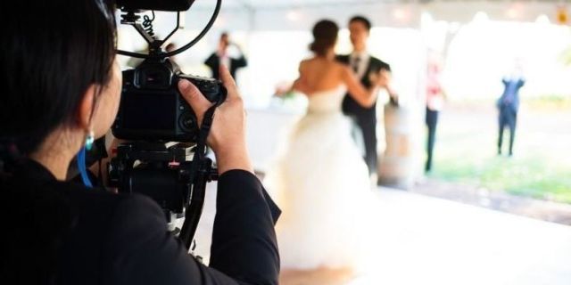 Dress, Video camera, Photograph, Camera, Bridal clothing, Cameras & optics, Camera operator, Videographer, Formal wear, Strapless dress, 