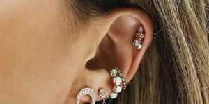 Ear, Body jewelry, Earrings, Organ, Close-up, Jewellery, Body piercing, Chin, Fashion accessory, Cheek, 
