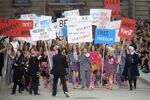 Feminist protesters storm the Chanel catwalk!