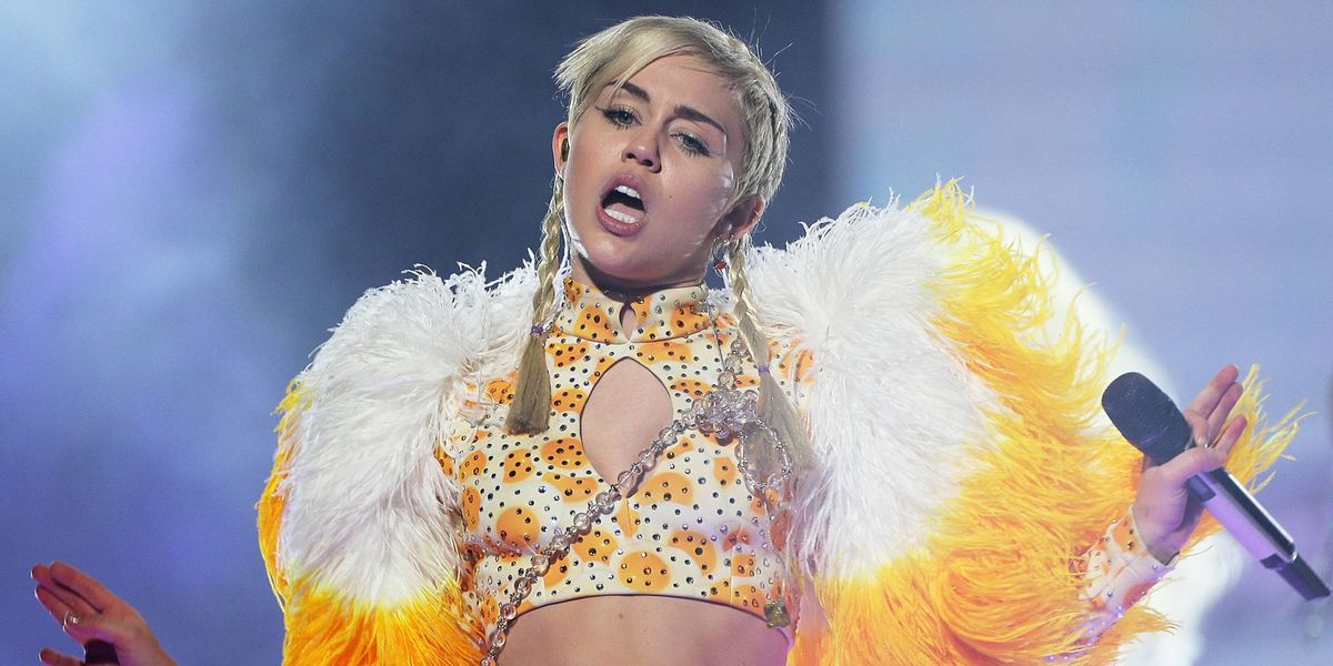 This Guy Snuck Backstage at a Miley Cyrus Concert by Dressing as a Janitor