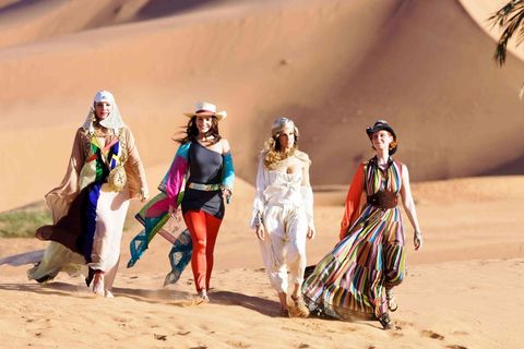 People, Landscape, Aeolian landform, Sand, Headgear, Beige, Desert, Costume design, Tribe, Walking, 