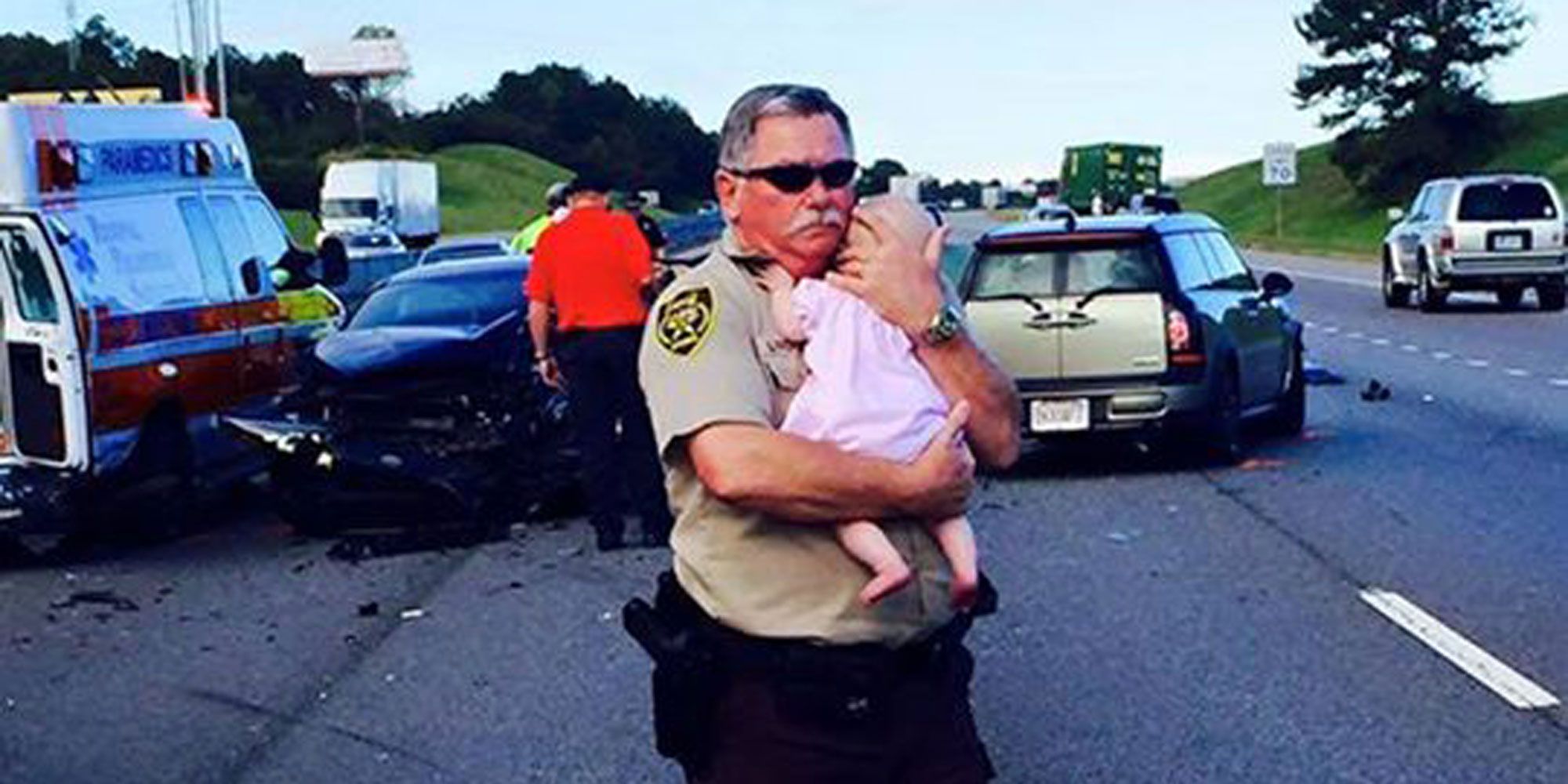 2019 year - Tear-Jerking Photo Shows Officer Comforting Baby Immediately After Car Crash 2019 year