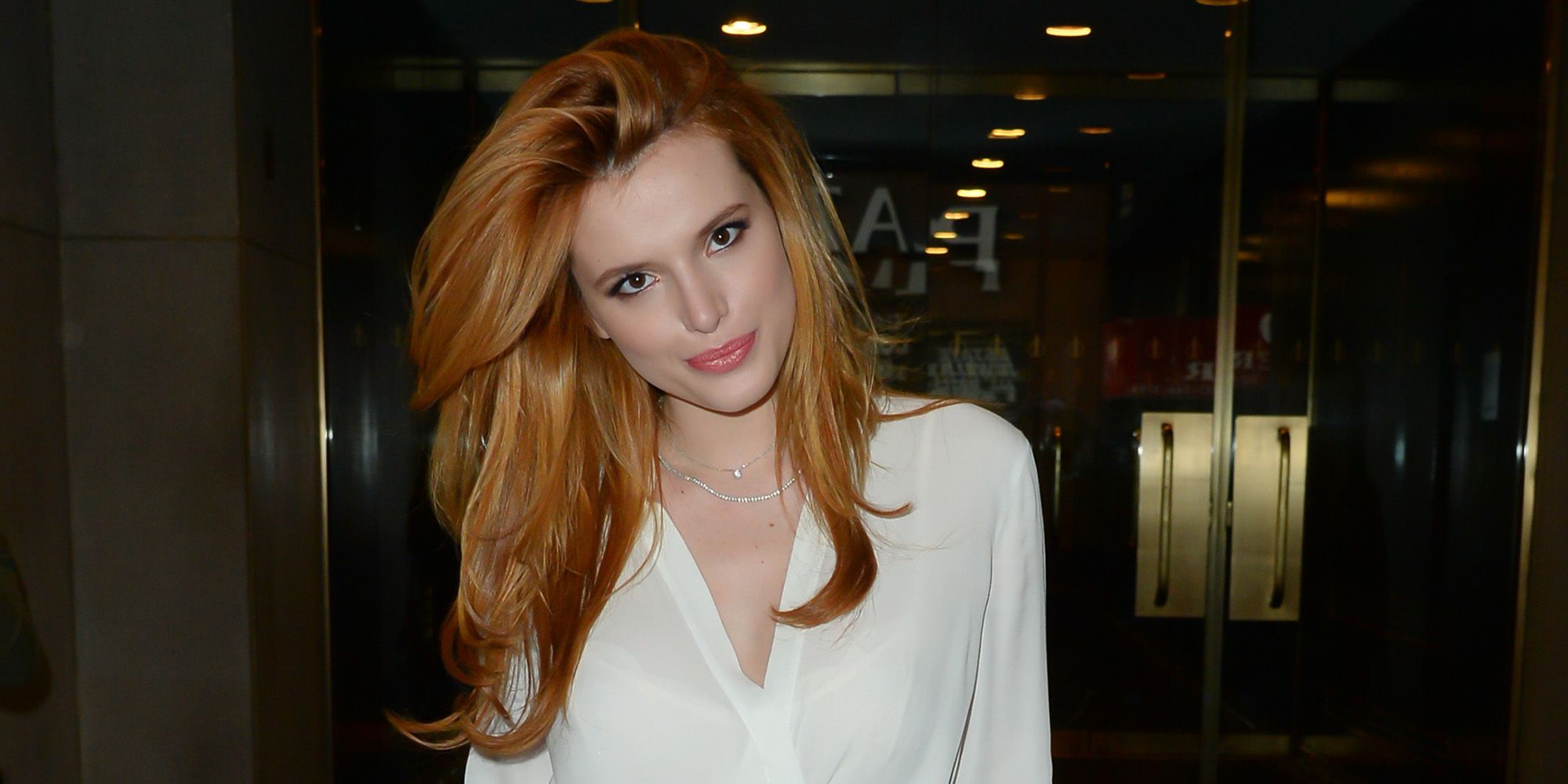 Bella Thorne Kisses Her Strawberry Blonde Hair Goodbye