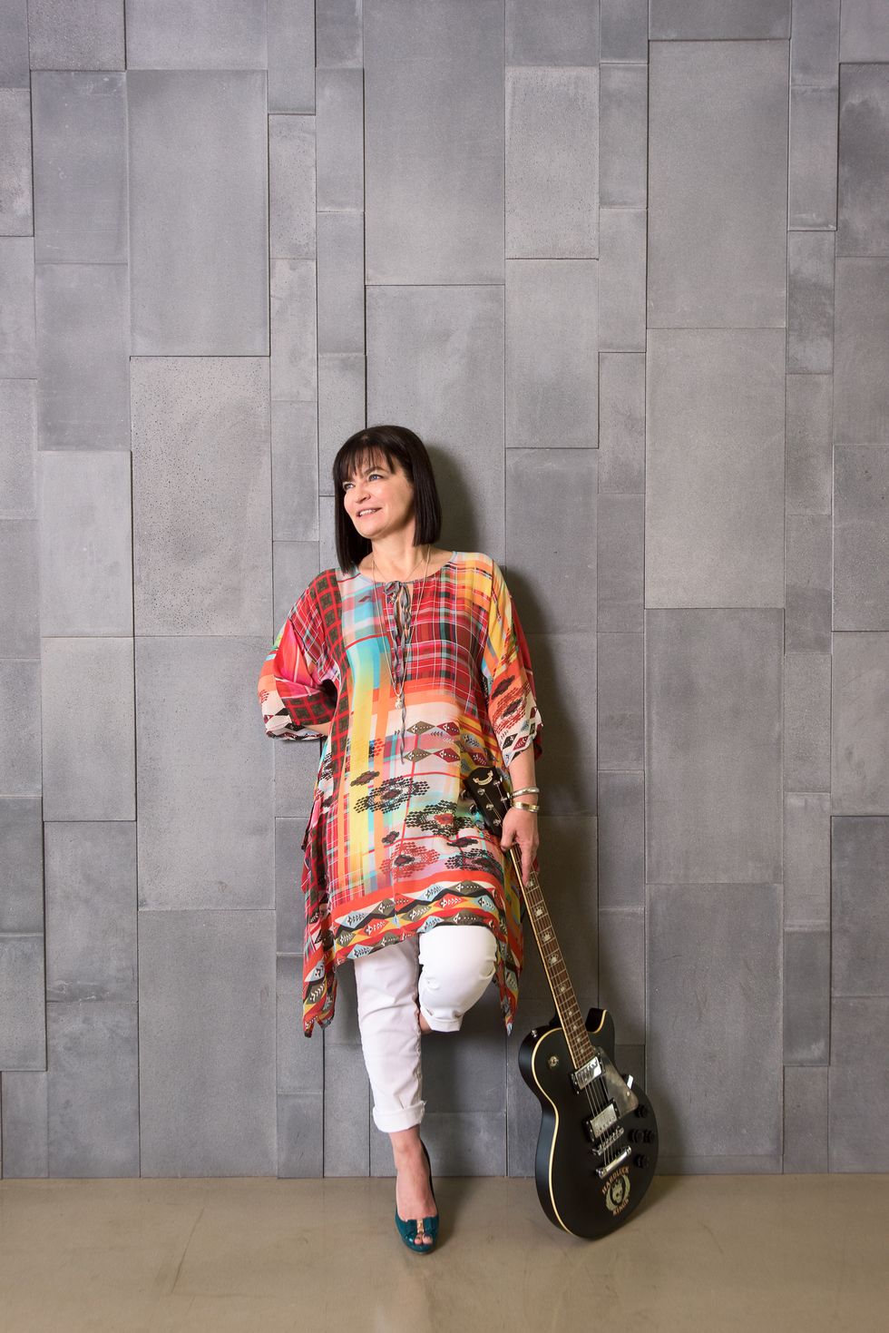 Musical instrument, Musical instrument accessory, Wall, Street fashion, Fashion, Woodwind instrument, Pattern, Wind instrument, Plaid, Maroon, 