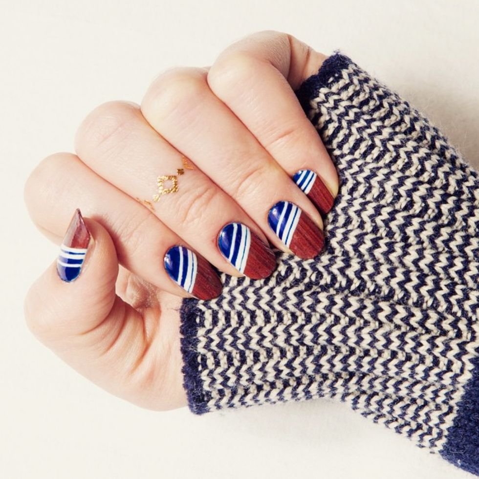 <p>Add an unexpected touch with a printed nail wrap in a mahogany wood design. Add blue and white diagonal stripes to the base to subtly address the nation's colors. </p><p>Design by <a class="_4zhc5 _ook48" title="palemoonseattle" href="https://www.instagram.com/p/xcrFw8SBI9/" target="_blank">@palemoonseattle</a><span class="redactor-invisible-space"></span></p>