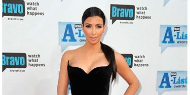 Even if you're <i>Keeping Up with the Kardashians,</i> it's damn hard look as hot as Kim. In a black LBD and open-toe pumps, she rocks the red carpet at Bravo's A-List Awards.