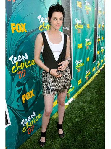 The vampy <i>Twilight</i> star donned a "spiked" minidress by Rock & Republic. Anyone surprised she won an award for her dramatic acting?