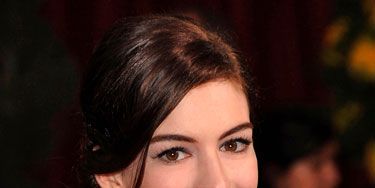 Anne Hathaway has killer lashes. Julie Harris, celebrity makeup artist in New York City, suggests you get her look by first letting your face lotion dry fully before working on your eyes. This way, you prevent smudging. And 
use a light powder over your under-eye concealer. 
