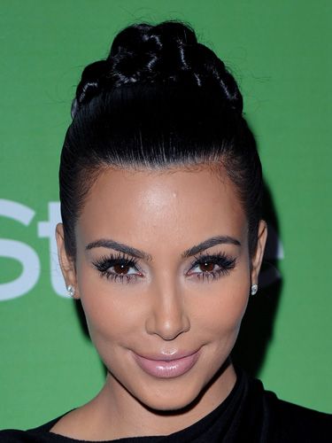 "Braids are really in right now, and they're very easy to make," Blandi says. Kim Kardashian's high-drama chignon is a fresh take on the trend. To score this look, first brush your hair back into a high pony on the crown and secure it with an elastic. Next, braid the tail. Gently coil the braid into a bun and fasten it in place with bobby pins.