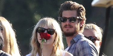 Yeah, they're out in public which can make an all-out makeout sesh awkward. But Andrew Garfield still shows he cares by slipping his hand into girlfriend Emma Stone's back pocket. <i>Aww</i>.