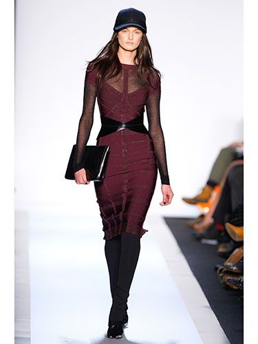 The bandage dress with a twist: sheer sleeves, a belt, and a baseball cap. That's right, a very chic baseball cap.