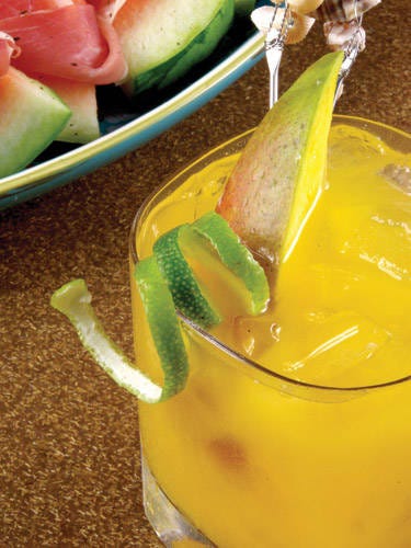 <i>1½ oz. Seven Tiki Spiced Rum<br />
1½ oz. The Perfect Purée Mango Puree<br />
1 oz. St. Germain Liqueur<br />
¾ oz. fresh lime juice<br />
Garnish: mango slice and lime twist</i><br /><br />
Combine all ingredients in a glass filled with ice. Stir and garnish with a mango slice and lime twist.
<br /><br /><i>Source: Manny Hinojosa, Mixologist</i> <i>1½ oz. Seven Tiki Spiced Rum<br />
1½ oz. The Perfect Purée Mango Puree<br />
1 oz. St. Germain Liqueur<br />
¾ oz. fresh lime juice<br />
Garnish: mango slice and lime twist</i><br /><br />
Combine all ingredients in a glass filled with ice. Stir and garnish with a mango slice and lime twist.
<br /><br /><i>Source: Manny Hinojosa, Mixologist</i>