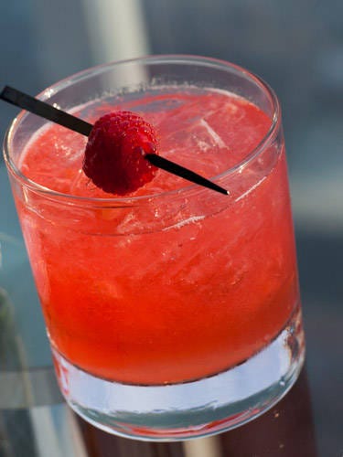 <i>2 oz. Brugal Extra Dry Rum<br />
½ oz. lemon juice<br />
½ oz. simple syrup<br />
4 raspberries<br />
Ginger beer</i><br /><br />
To make simple syrup, mix equal parts hot water and sugar until sugar is dissolved. Muddle raspberries in a cocktail shaker. Add ice, rum, lemon juice, and simple syrup. Shake vigorously and strain into a glass filled with ice. Top with ginger beer.
<br /><br /><i>Source: Kenneth McCoy, Mixologist</i> <i>2 oz. Brugal Extra Dry Rum<br />
½ oz. lemon juice<br />
½ oz. simple syrup<br />
4 raspberries<br />
Ginger beer</i><br /><br />
To make simple syrup, mix equal parts hot water and sugar until sugar is dissolved. Muddle raspberries in a cocktail shaker. Add ice, rum, lemon juice, and simple syrup. Shake vigorously and strain into a glass filled with ice. Top with ginger beer.
<br /><br /><i>Source: Kenneth McCoy, Mixologist</i>