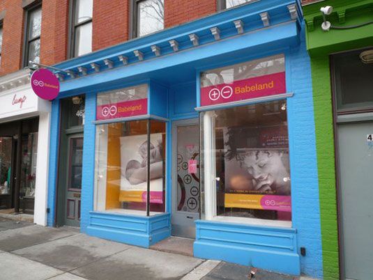 Facade, Fixture, Sidewalk, Retail, Signage, Door, Display window, Awning, 