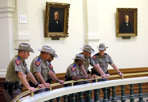 Hat, Picture frame, Sun hat, Baluster, Handrail, Tourist attraction, Official, Law enforcement, Collection, Varnish, 