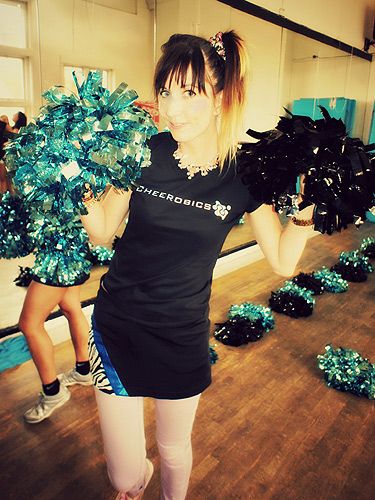 Pom poms are essential to any cheerleading costume.  Cheerleading,  Cheerleading jumps, Cheerleading pom poms