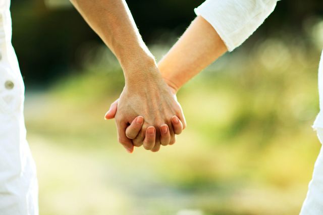 Couple holding hands