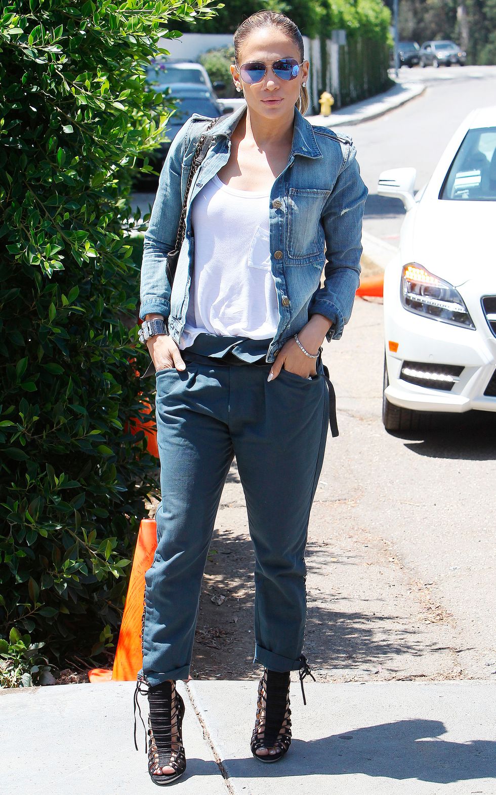 Jennifer Lopez wearing a denim jacket at a party - celebrity style photos - fashion - cosmopolitan.co.uk