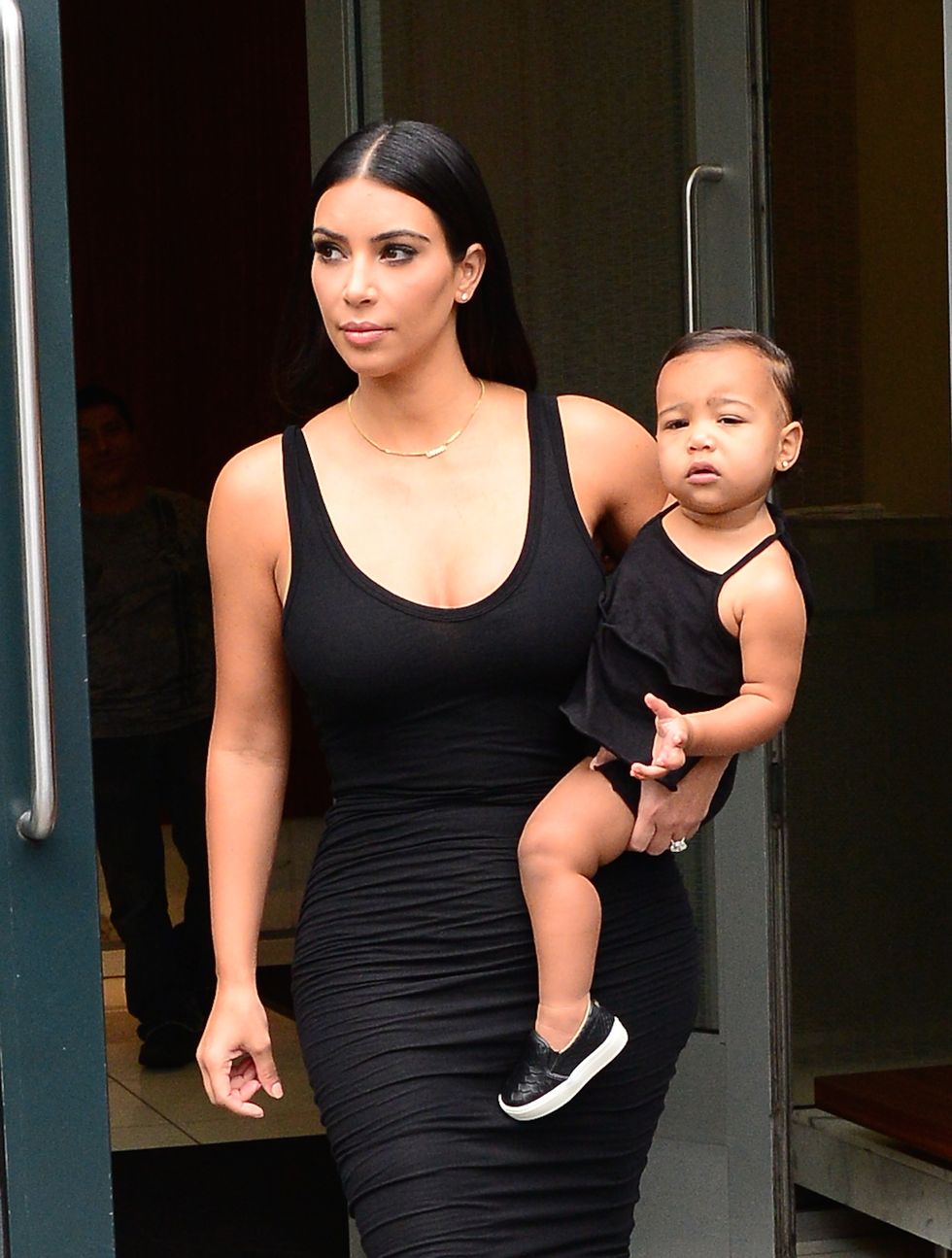 Kim Kardashian and North West wearing matching black dresses - cosmopolitan.co.uk