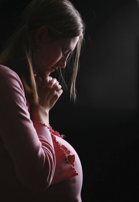 Sad pregnant woman Ireland's anti-abortion laws