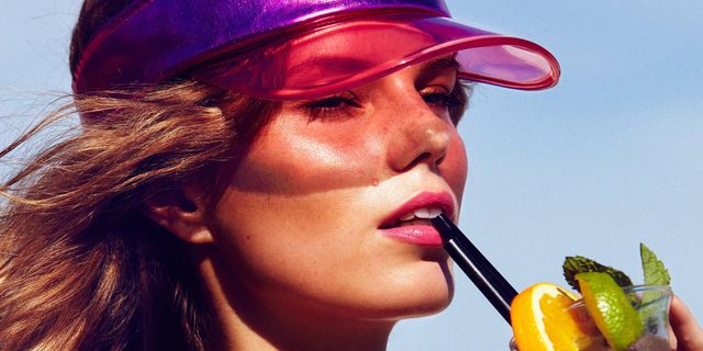 Girl with good skin sipping cocktail - 10 surprising skin tips everyone should know - cosmopolitan.co.uk