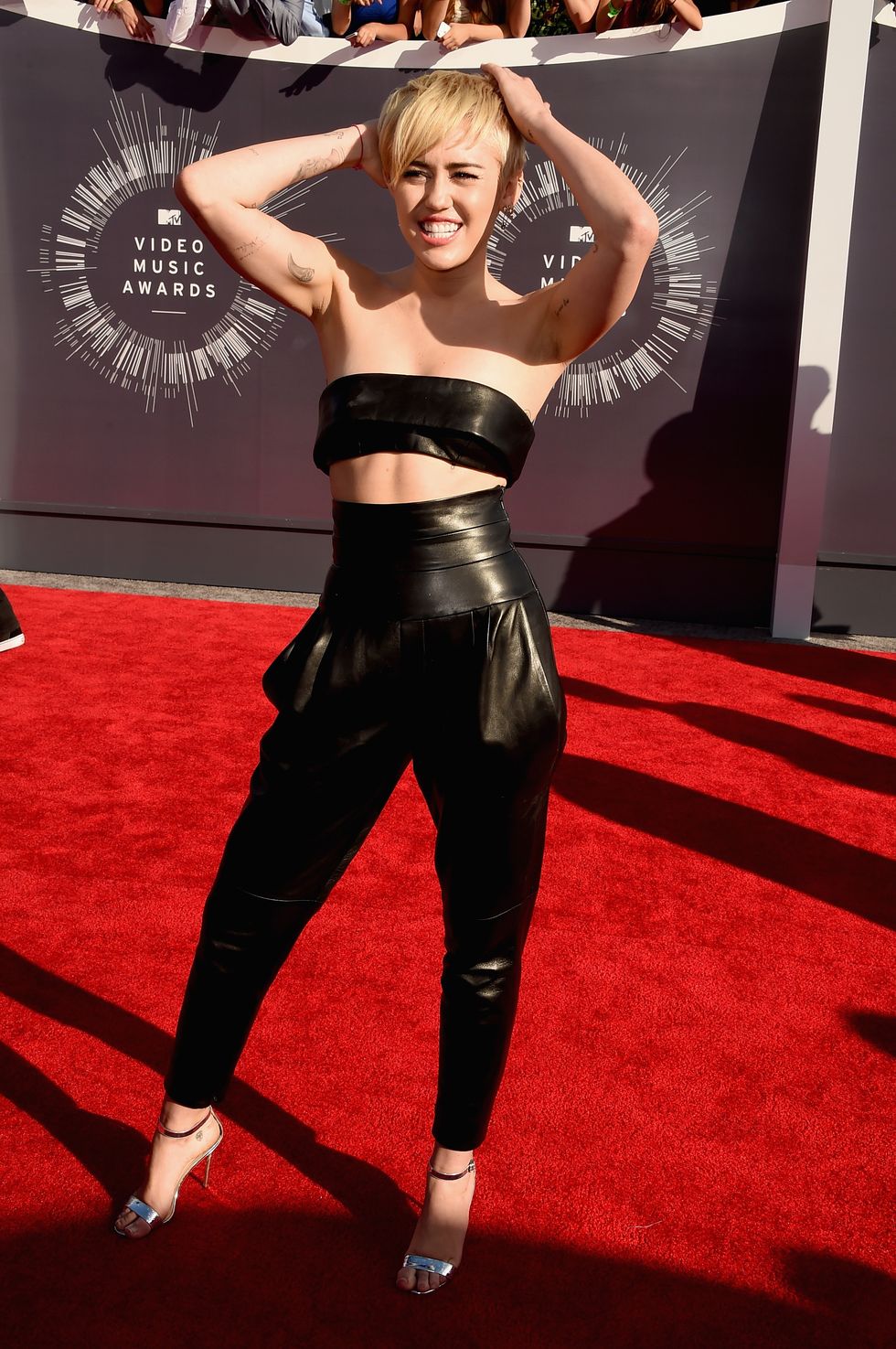 Miley Cyrus looks sexy in leather two-piece on the MTV Video Music Awards red carpet