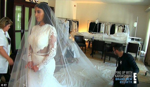 Kim Kardashian tries on her wedding dress on Keeping Up With The Kardashians