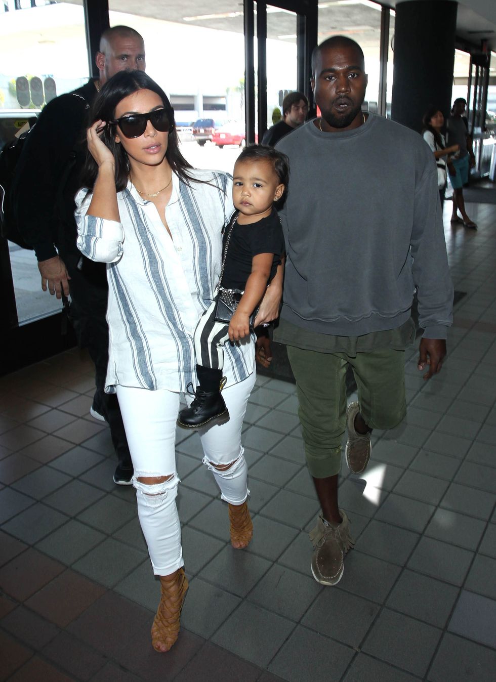 Kim Kardashian, Kanye west and North at airport