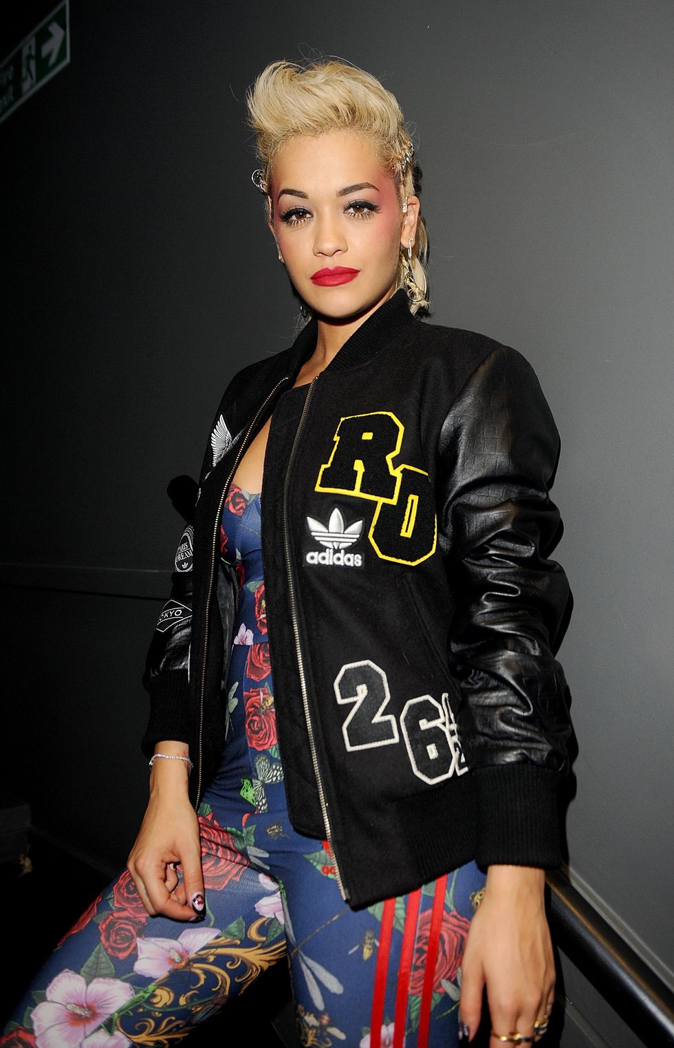 Rita Ora wearing floral Adidas top and leggings and bomber jacket