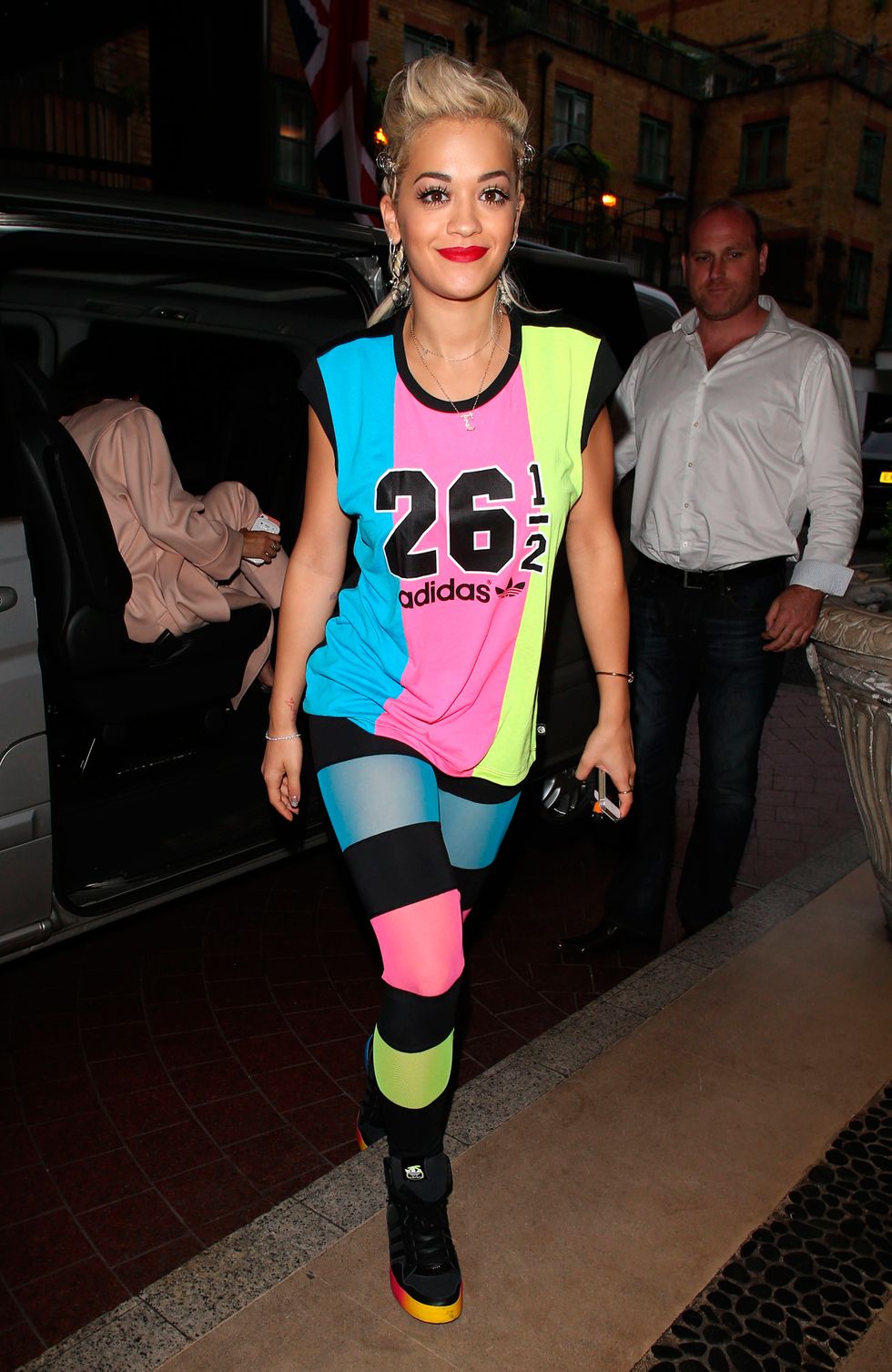 Rita Ora wearing colour-block top and leggings at Adidas launch