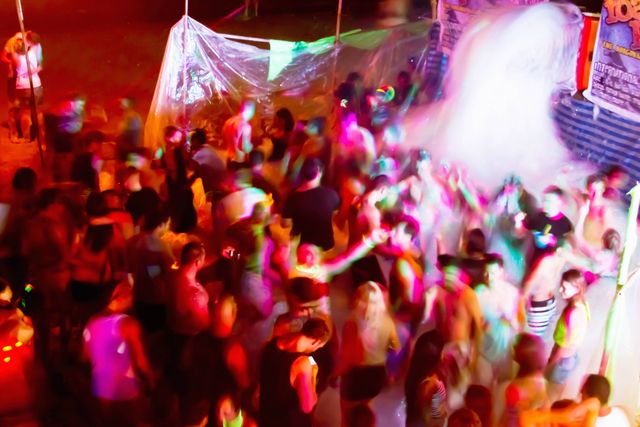 A picture of people dancing at a Full Moon Party