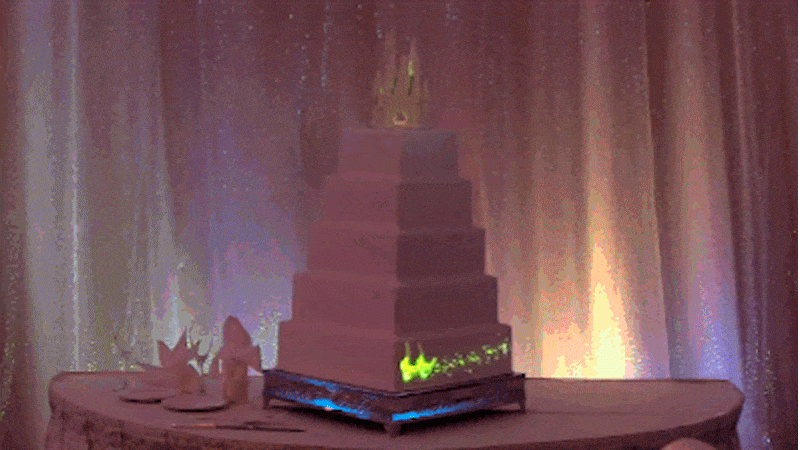 Disney light projection wedding cake