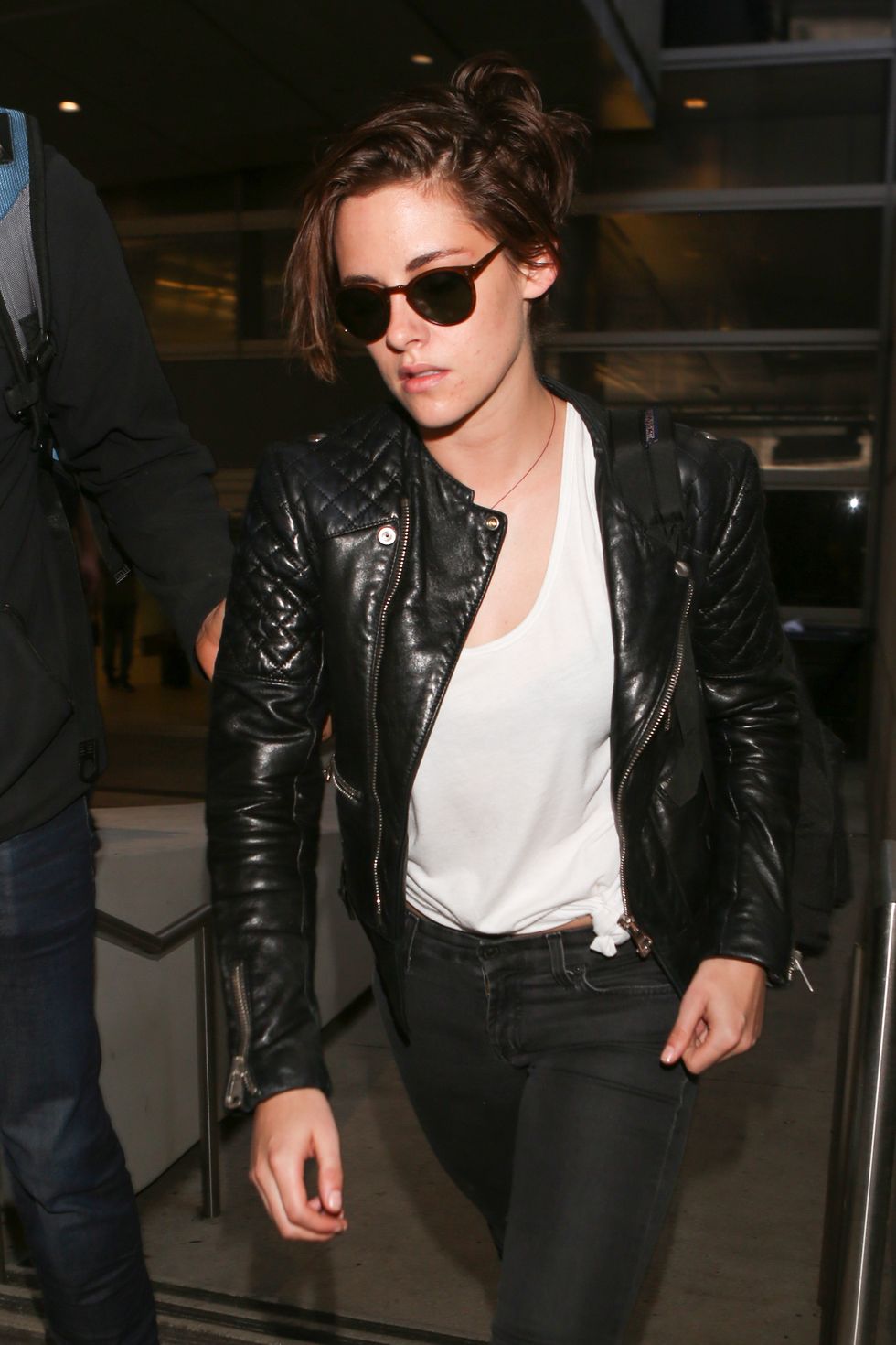 Kristen Stewart wearing a leather jacket at LAX