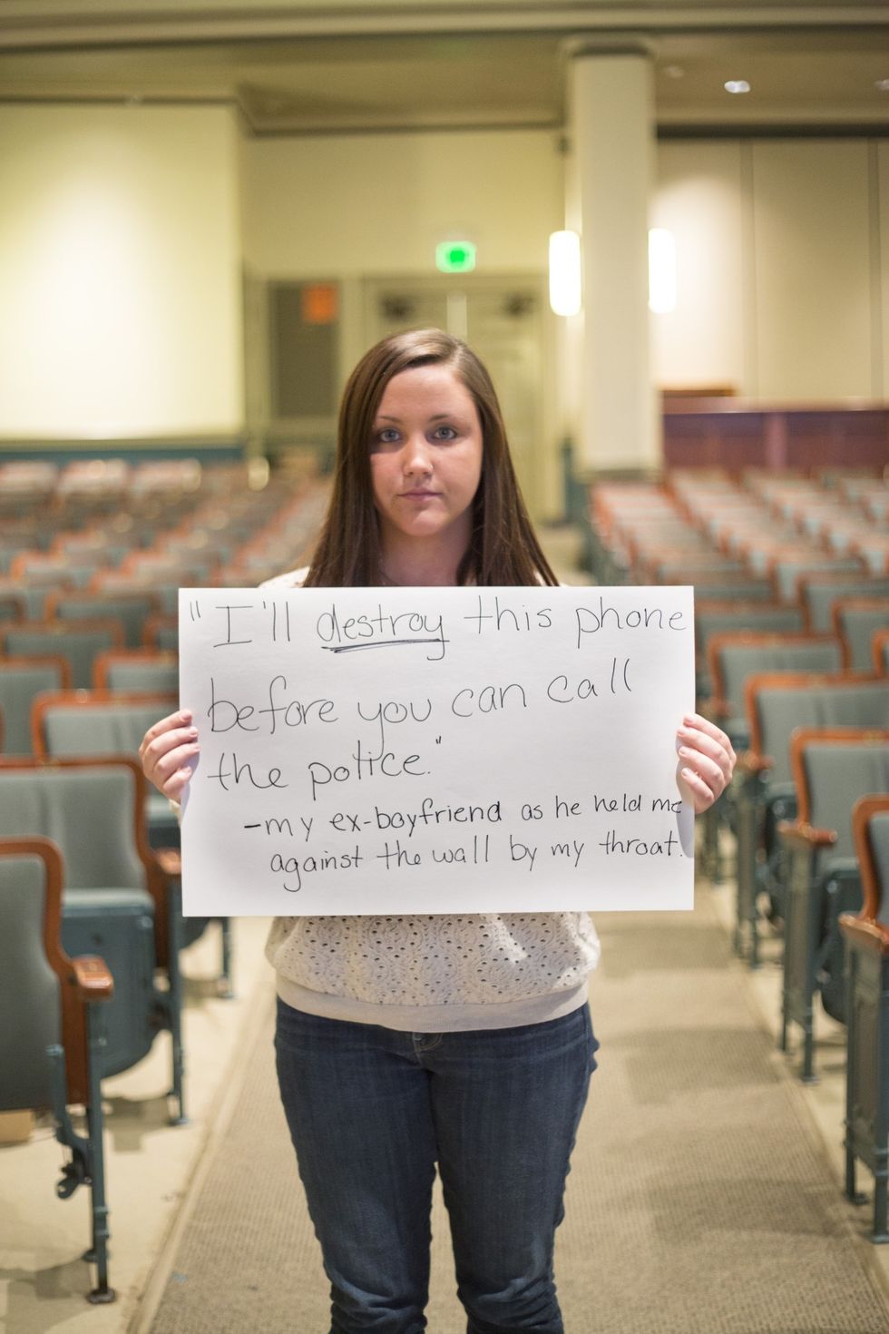 Brave women are photographed with signs quoting the terrifying words of their abusers