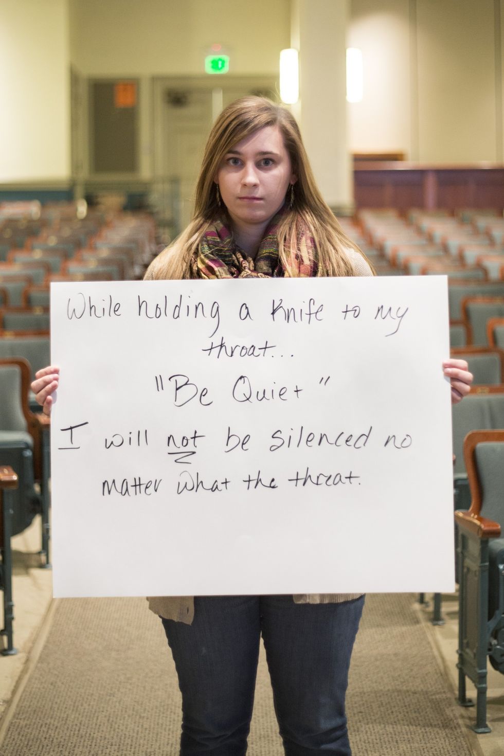 Brave women are photographed with signs quoting the terrifying words of their abusers