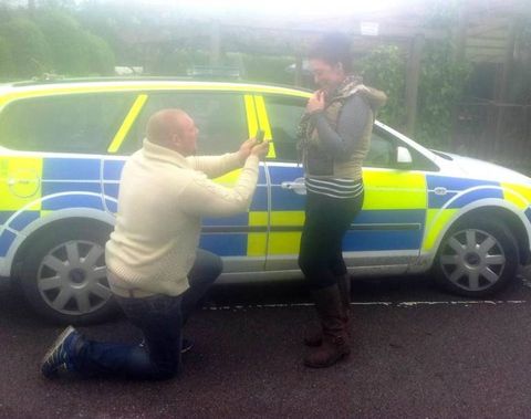 This romantic man proposed to his girlfriend in the back of a police car