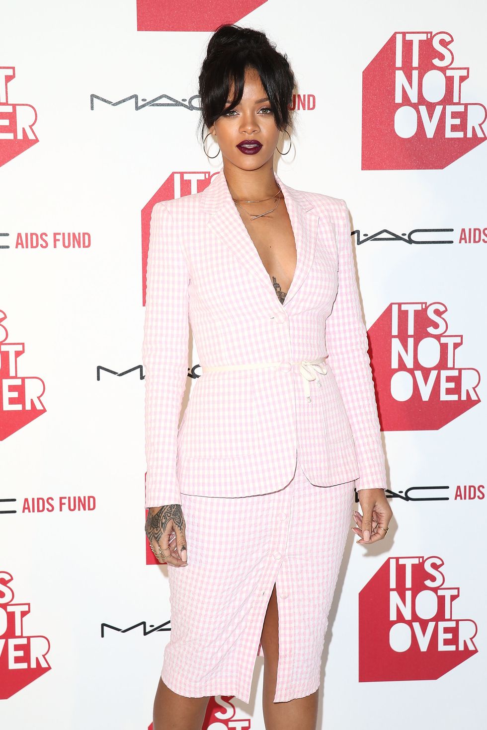Rihanna wearing pink check suit for MAC Cosmetics event