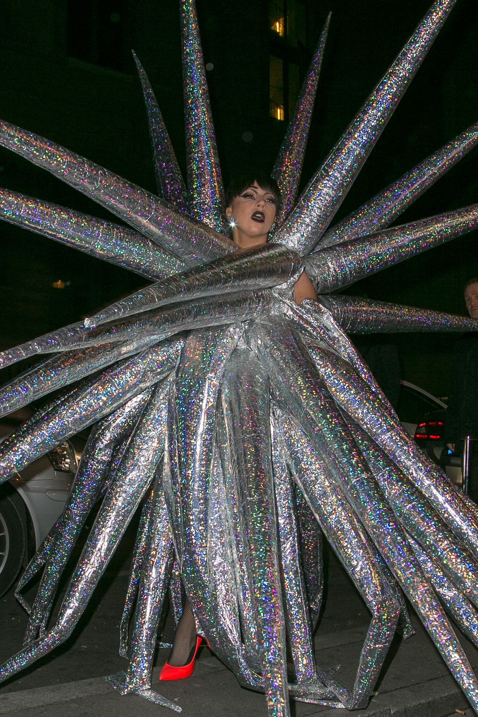 Lady Gaga dresses as a silver star