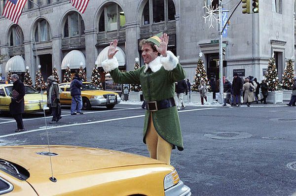Buddy The Elf walking through New York
