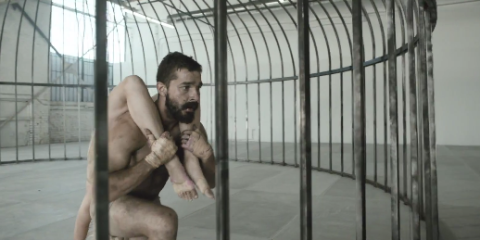 Sia S New Music Video Features Shia Laboeuf Semi Naked In A Cage