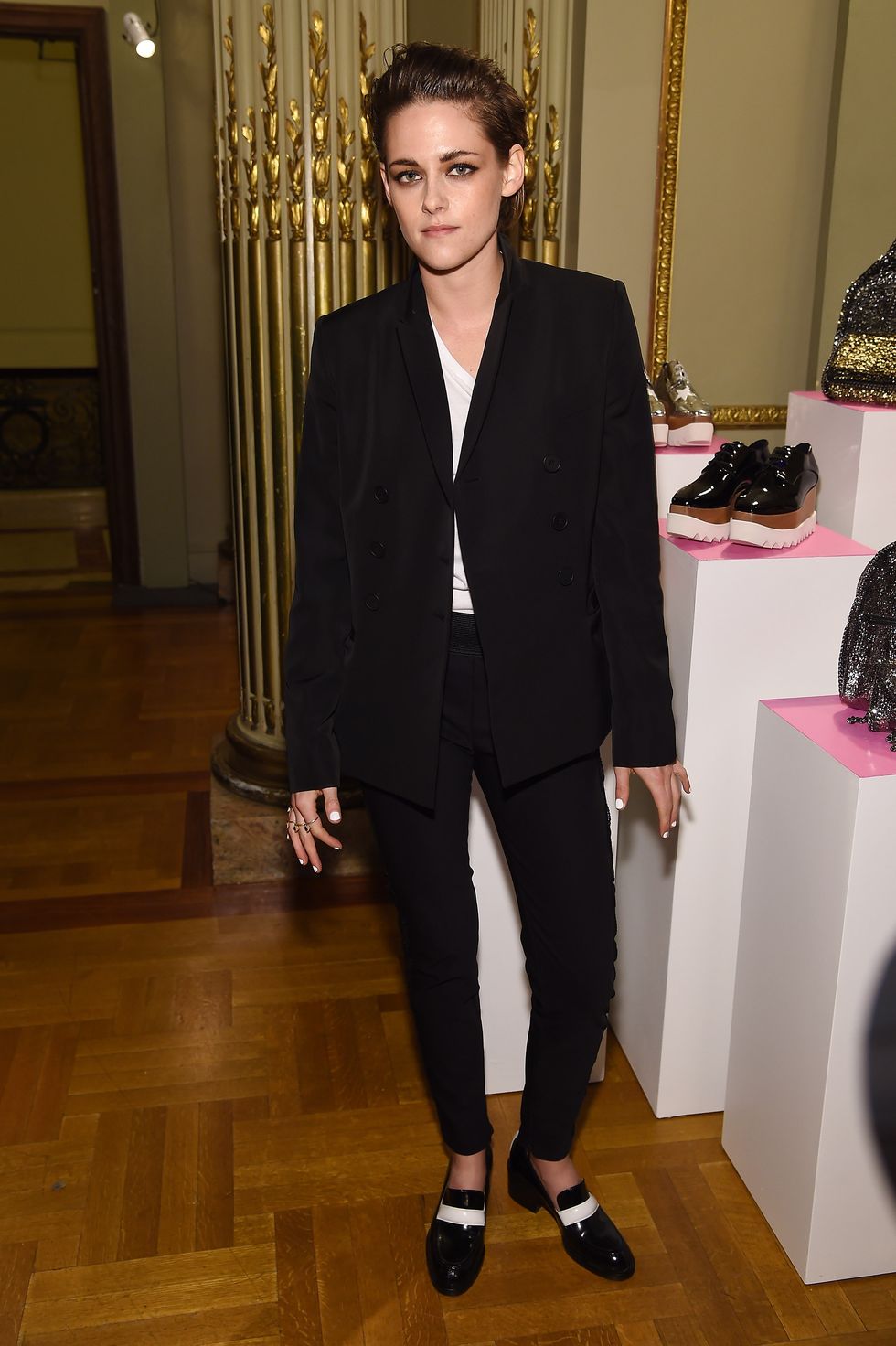 Kristen Stewart in a black suit at the Stella McCartney Autumn 2015 presentation