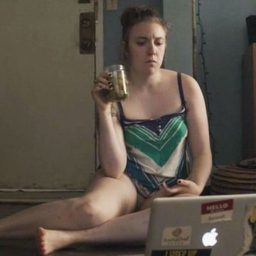 Hannah from GIRLS on laptop computer