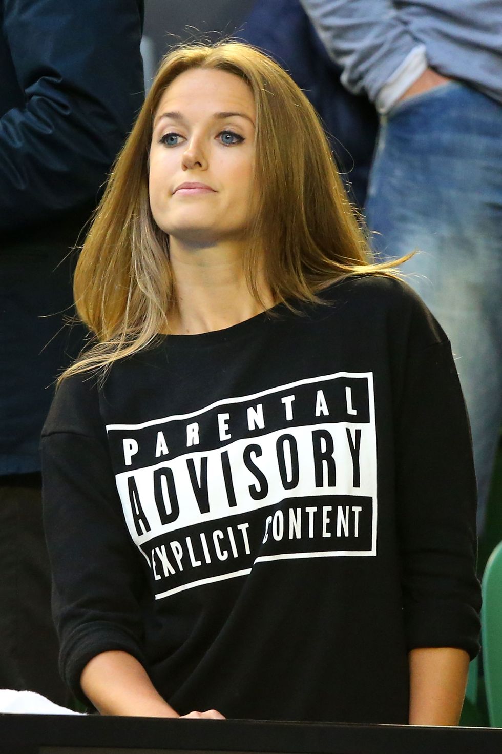 Kim Sears wears an explicit content sweatshirt at the Australian Open final in response to controversy surrounding her swearing at an earlier match