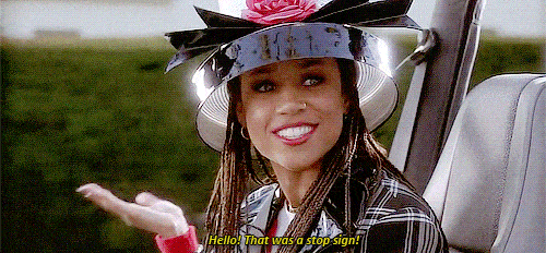 Dionne in Clueless wearing a gigantic hat GIF