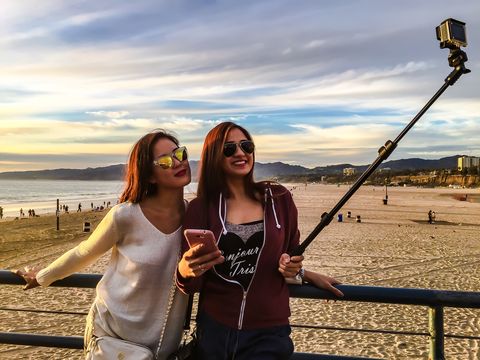 Girls using a selfie stick