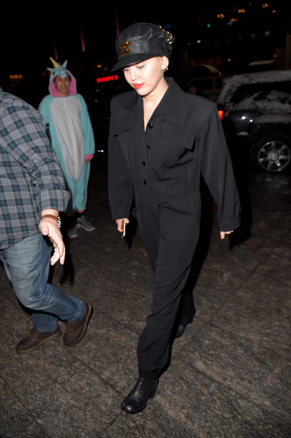 Miley Cyrus wears a black jumpsuit in New York