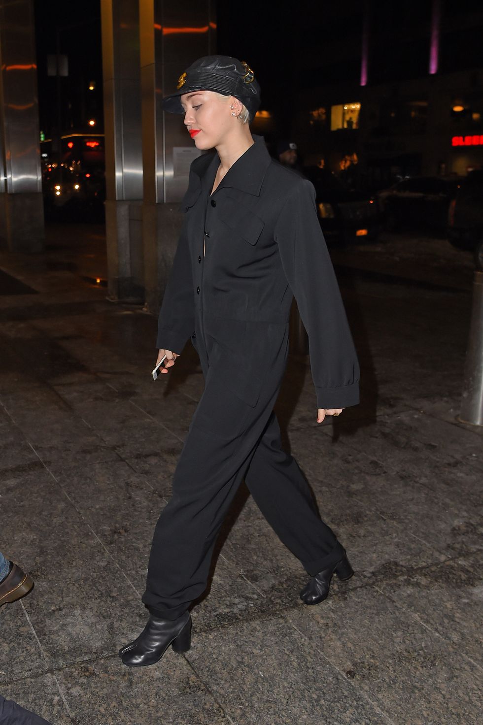 Miley Cyrus in New York wearing a black jumpsuit